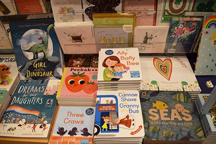 Books laid out in a shop display.