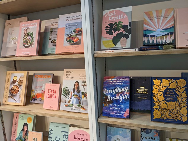 Selection of pink books on shelving