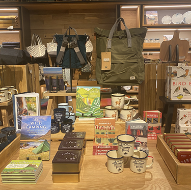 Groups of products on wooden display table.