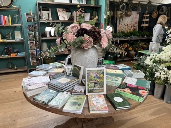 Books displayed on a table in a retail setting