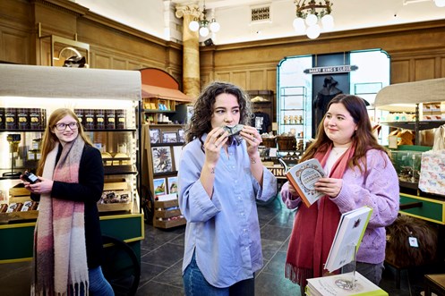 Shoppers browsing products in The Real Mary King's Close.