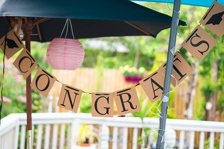 Congrats bunting in a garden setting