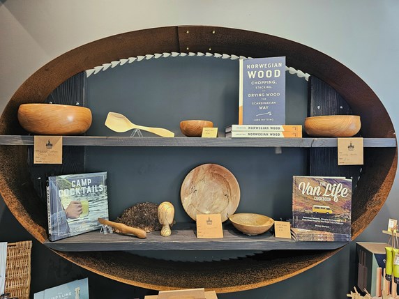 Books and wooden products on a shelving display